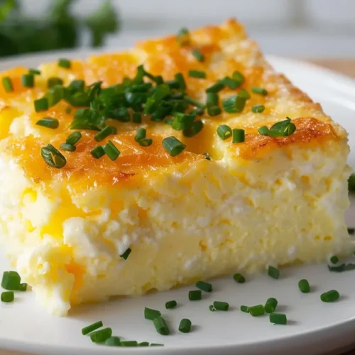 Golden baked cottage cheese eggs garnished with chives.